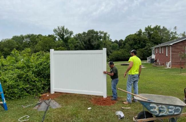White PVC vinyl privacy fence panel installation example