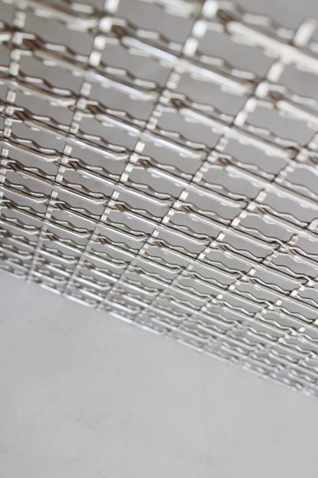 Architectural woven mesh panel application