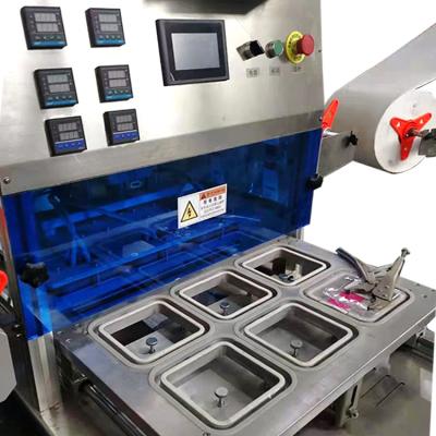 中国 200L/H Yogurt Cup Sealing Machine 50Hz 220Vステンレス鋼のAndアルミニウム 販売のため