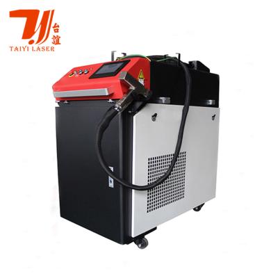 Chine Machine tenue dans la main de nettoyage de laser de rouille de commande numérique par ordinateur, machine de nettoyage de rouille de laser en métal à vendre