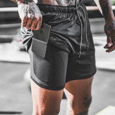 中国 Fit Training Sports Double Layer Workout Pants Elastic Gym Men Cotton Shorts 販売のため
