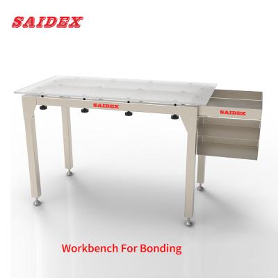 China El fabricante de Saide suministra directamente el banco de trabajo de unión acrílica, plataforma de trabajo especial para la aplicación de pegamento en venta