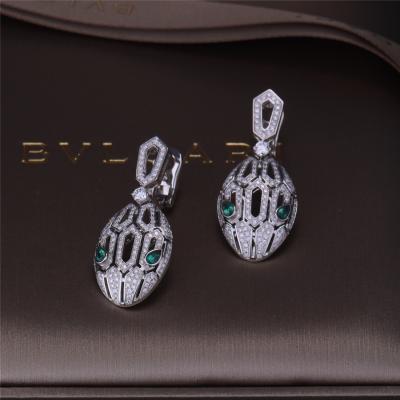 China Luxury Gold Brand Serpenti Earrings in 18K White Gold set with Emerald Eyes and with pavé diamonds Snake Head for sale
