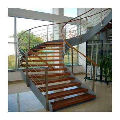 China Timber wood tread arched stairs Mali curved stairway with landing for sale