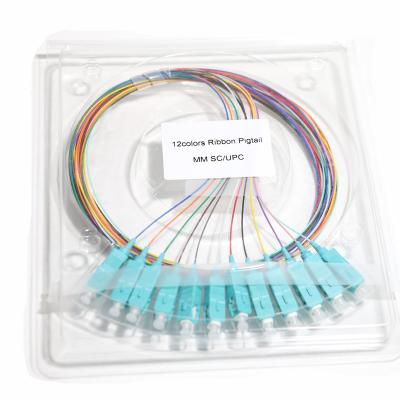 China Cable de conexión de fibra óptica azul SC&UPC 12Core Ribbon Pigtail Blue Port 09mm Gigabit Ethernet Velocidades 1.5M 2M 3M en venta
