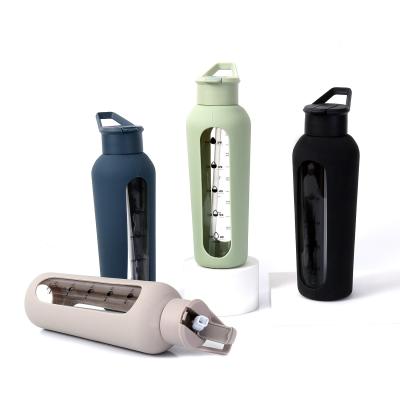 China Outdoor Sport Glass Water Bottles With Silicone Cover And Straw for sale