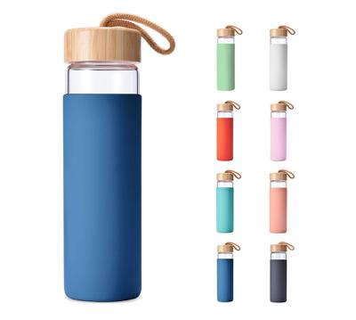 China 500ml Bpa Free Safe Borosilicate Glass Water Bottle With Bamboo Lid Silicone Sleeve for sale