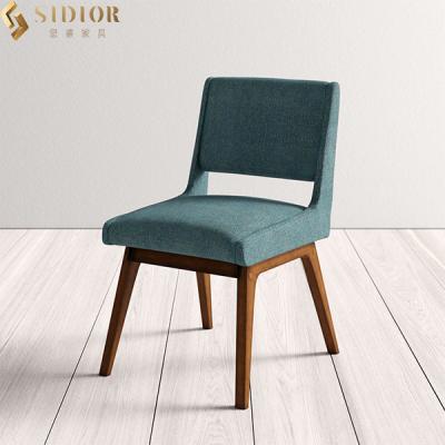 China La tela del OEM del ODM tapizó la silla de cena de madera sólida para el restaurante en venta
