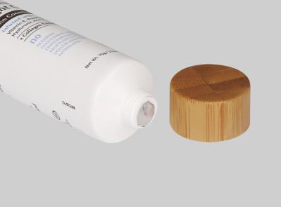 China tubo 35-110ml de bambu que empacota o costume vazio para hidratar o tubo plástico cosmético da loção com tampa de madeira à venda