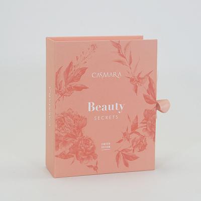 China Beauty Secrets Luxury Cardboard Paper Gift Box Cosmetic Packaging With Ribbon for sale