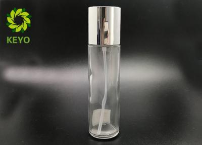 China Cylinder Empty Cosmetic Bottles With Silver Screw Cap , 100ml Glass Lotion Bottles for sale