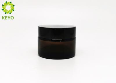 中国 30gこはく色色の表面クリームのガラス瓶、黒い帽子が付いているクリーム色の貯蔵の瓶 販売のため