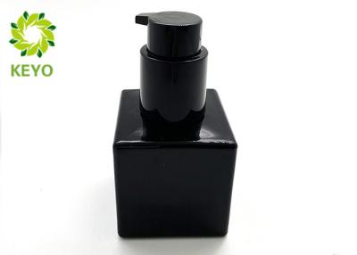 China Black Square Glass Bottle With Lock Pump For Cosmetic Package for sale