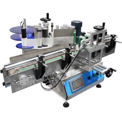 China Tabletop Three Face Labeler Tinplate Can Adhesive Round Bottle Automatic Label Applicator Machine for sale
