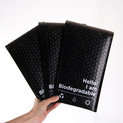 China Biodegradable a prueba de humedad del anuncio publicitario de los bolsos plásticos negros ultraligeros del envío en venta