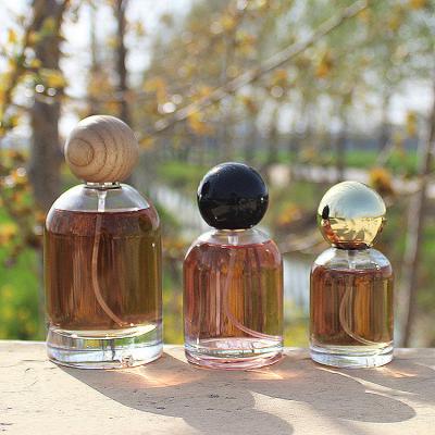 China Transparent Perfume Glass Spray Bottle 30ML 50ML 100ML Empty With Ball Cap for sale