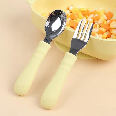 China Yellow Silicone Spoon And Fork Heat Insulation silicone feeding spoon for sale