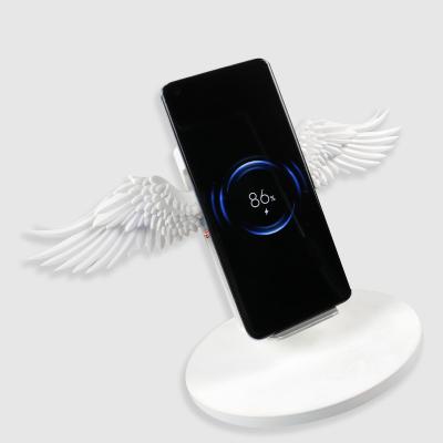 China Cute Plastic Phone Wings Wireless Charger 5V 1.67A With LED Light for sale