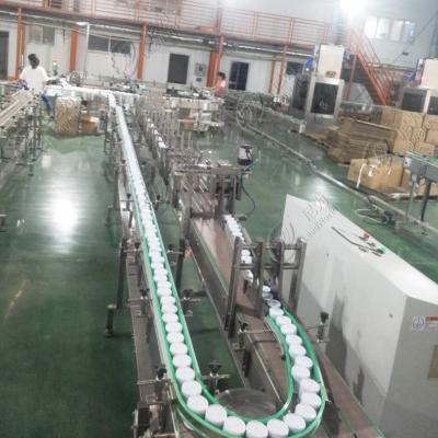 China Food Canned Bottles Conveying Slat Top Chain Conveyor For Industry Packaging Line for sale