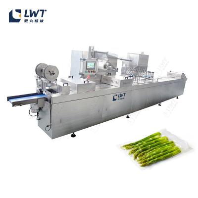 China Línea de embalaje de bolsas de frutas y verduras Máquina de embalaje automática de vacío de llenado de nitrógeno en venta