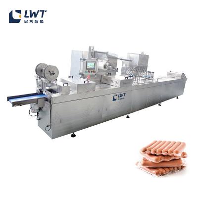 China Salchicha Alimentos Equipo de sellado automático de carne de cerdo y carne de res de película de estiramiento Máquina de embalaje al vacío en venta
