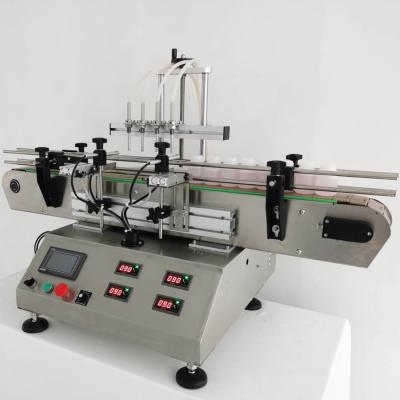Chine Automatique de bureau à quatre têtes pompe magnétique machine de remplissage de liquide posologie de haute précision à vendre