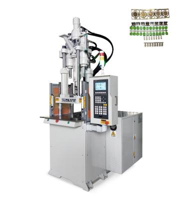 Cina 55 tonnellate di macchina di stampaggio a iniezione verticale standard per connettori in PVC in vendita