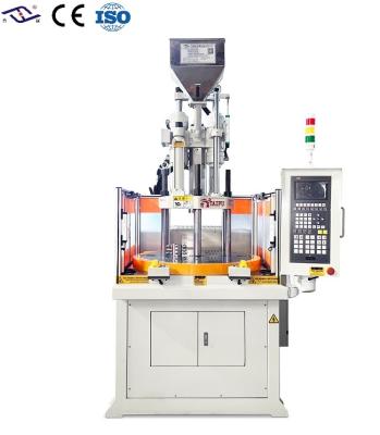 China Máquina de moldeo por inyección vertical rotativa de 35 toneladas para manijas de plástico en venta