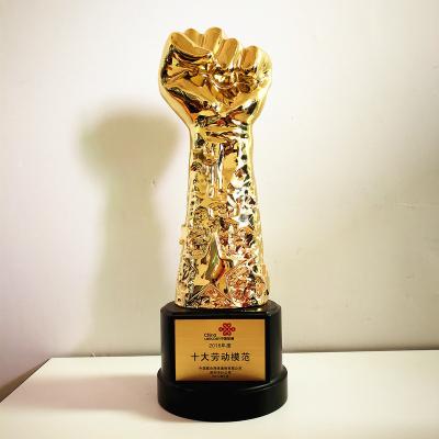 China Souvenir gift Golden polyresin Fist Trophy Company Staff Awards for sale