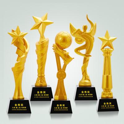 China Diverso diseño de oro Polyresin se divierte los regalos del recuerdo del trofeo del día en venta