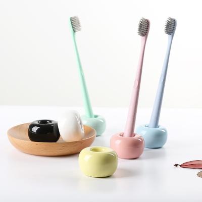 China Household Ceramic Toothbrush Holder Set Stand With Pink Blue Green Color for sale