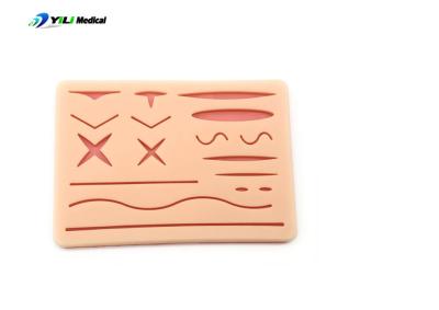 China Pad de sutura de ferida de silicone de pele realista Treinamento de simulação de trauma Prática de tratamento de feridas à venda