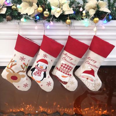 China Christmas Stockings Set of 4 Felt Santa Reindeer Snowman Penguin Stockings Xmas Tree Ornaments Party Decor for sale