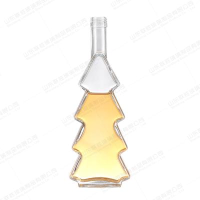 China Other Beverage 500ml Christmas Tree Glass Bottles with Screw Cap Clear Empty Decoration for sale