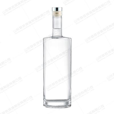 China 750ml Oval Cylindrical Thin Tall Flat Glass Bottle for Whiskey Vodka Gin Strong Wine for sale