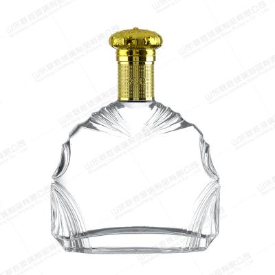 China 750ml 700ml 500ml Classic Transparent Rum Whiskey Pine Spirits in Irregular Frame Bottles for sale
