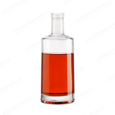 China ODM 500ml 700ml 750ml Round Liquor Glass Bottle With T Sealing Cork for sale