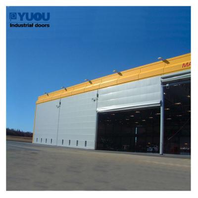 Китай Двойная ткань PVC штабелируя высоту IP64 ширины 17m дверей стальную 42m ангара для самолета продается