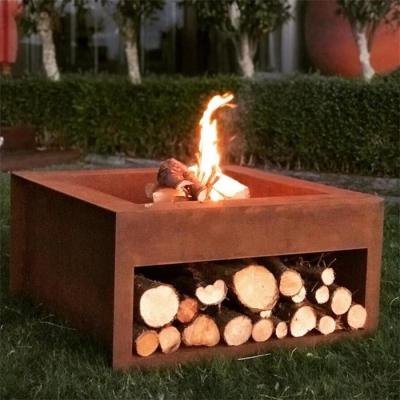 China Backyard Rust Finish Wood Burning Corten Steel Cube Fire Pit With Wood Storage for sale