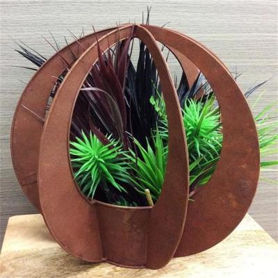 China Large Outdoor Decorative Rusty Metal Corten Steel Garen Blade Ball Flower Pot en venta