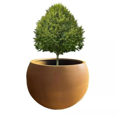 China Customized Corten Steel Irregular Round Planter Boxes Streetscape Tree Pots for sale