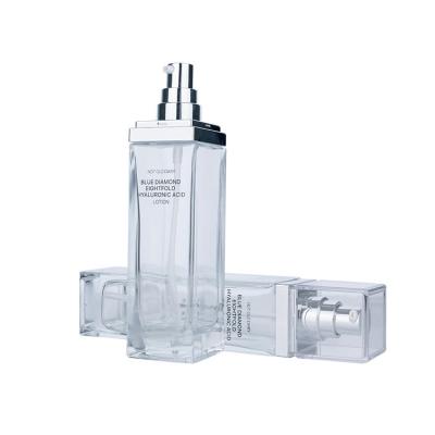 China 100 ml 120 ml garrafas de loção transparentes quadradas pequenos recipientes de vidro para cosméticos à venda