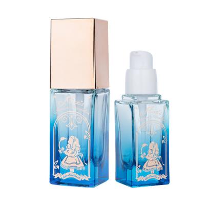 China 30ml Semi-Transparent Glass Foundation Bottle with Luxurious Blue and Gold Design for sale