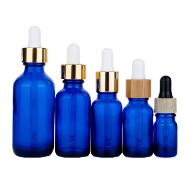 China Botellas de gotero de vidrio azul de 25 ml y 60 ml Botellas de gotero de 30 ml con pipeta en venta