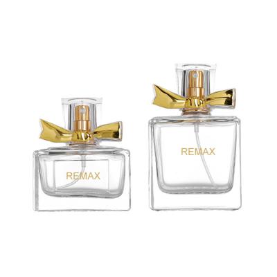 China Luxury 50ml Glass Perfume Bottle 10000pcs With Gold Bow Cap for sale