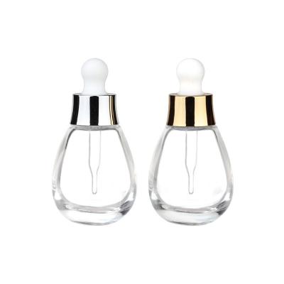 China Functional Cosmetic Dropper Bottles 30ml Thick Glass Bottle with Gold Dropper for sale