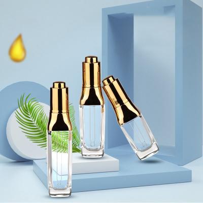China Sophisticated Essential Oil Bottles with Luxurious Gold Press Dropper 30ml 40ml 50ml for sale
