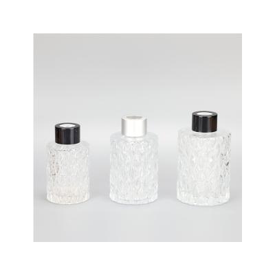 China High Quality and Safety Gift Round Pattern Clear Glass Diffuser Bottle for sale