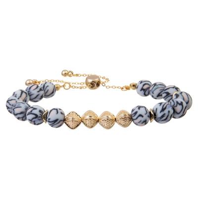 Chine Le rond d'impression de léopard perle avec le cadeau réglable de fille de bracelet de perles en métal d'or à vendre