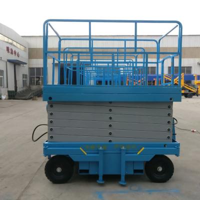 中国 12m Hydraulic Lifting Platform Rough Terrain Scissor Lift No Manual Traction 販売のため